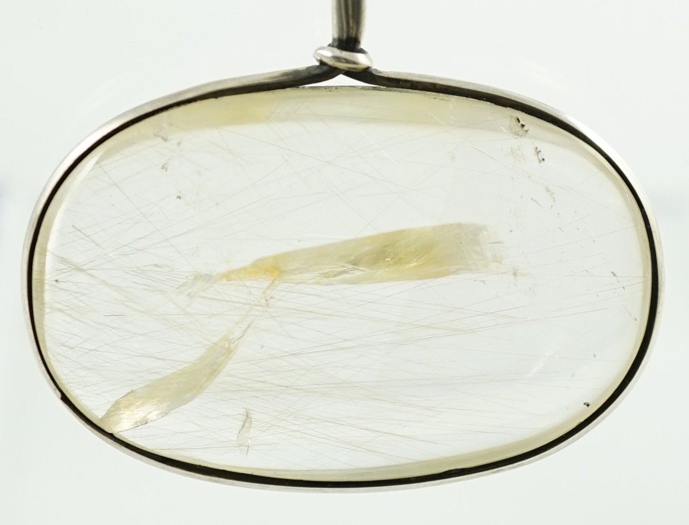 A Vivienne Torun for Georg Jensen Danish sterling silver and rutilated oval quartz set pendant necklace
